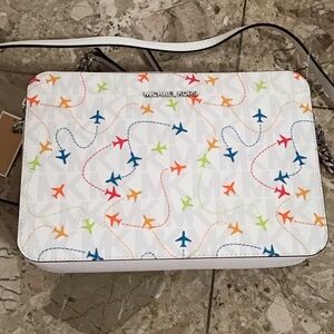 Michael Kors MK white JET SET airplanes crossbody camera bag, adjustable strap.